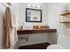 Modern powder room with vessel sink, wood countertop, and decorative accents at 999 N Emerson St # 9, Denver, CO 80218