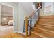 Open staircase with wooden steps and black metal railings, offering a glimpse into a bedroom at 999 N Emerson St # 9, Denver, CO 80218
