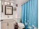 Well-maintained bathroom with a stylish vanity, toilet, and shower curtain at 6495 E Happy Canyon Rd # 79, Denver, CO 80237