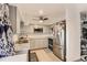 Bright kitchen with stainless steel appliances, granite countertops, and convenient storage at 6495 E Happy Canyon Rd # 79, Denver, CO 80237