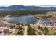 Stunning aerial view of lakefront homes nestled near a tranquil lake and mountainous backdrop at 16470 Mountain Flax Dr, Monument, CO 80132