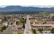 Aerial view showcasing a main street lined with trees and buildings in a charming town at 16470 Mountain Flax Dr, Monument, CO 80132