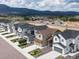 Aerial view of a neighborhood, showcasing well-maintained homes and mountain views at 16470 Mountain Flax Dr, Monument, CO 80132