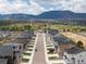 Scenic aerial perspective of a new home community with beautiful mountain backdrop at 16470 Mountain Flax Dr, Monument, CO 80132