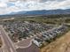 Aerial view showcasing a community with mountain views and well-maintained streets at 16470 Mountain Flax Dr, Monument, CO 80132