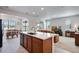 Open-concept kitchen with a central island and seamless transition to the adjacent dining area at 16470 Mountain Flax Dr, Monument, CO 80132
