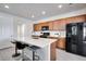 Bright kitchen featuring a large island, stainless appliances, and modern finishes at 16470 Mountain Flax Dr, Monument, CO 80132