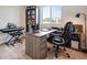 Bright office space featuring a large window, modern desk, piano, and comfortable executive chair at 16470 Mountain Flax Dr, Monument, CO 80132