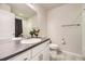 Bright bathroom with white vanity, elegant sink, and tiled shower featuring modern fixtures at 15576 W Washburn Cir, Lakewood, CO 80228