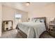 Inviting bedroom with a comfortable bed, natural light, and stylish decor, offering a relaxing space at 15576 W Washburn Cir, Lakewood, CO 80228