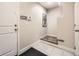 Welcoming entryway features clean lines, tile flooring, and a convenient step-up for easy access at 15576 W Washburn Cir, Lakewood, CO 80228