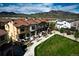 Beautiful townhomes feature red tile roofing and manicured lawns with stunning mountain views at 15576 W Washburn Cir, Lakewood, CO 80228