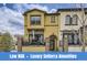 Charming two-story home with a well-maintained front yard and a welcoming entrance with brick design at 15576 W Washburn Cir, Lakewood, CO 80228