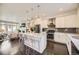 Spacious kitchen with an island, stainless appliances, and an open design perfect for entertaining and Gathering gatherings at 15576 W Washburn Cir, Lakewood, CO 80228