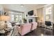 Cozy living space with a fireplace, large TV, and ample seating, perfect for relaxing and entertaining guests at 15576 W Washburn Cir, Lakewood, CO 80228