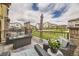 Relax on this outdoor patio with comfortable seating and a fire pit, ideal for entertaining or relaxing under the sky at 15576 W Washburn Cir, Lakewood, CO 80228