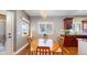 Cozy dining area with hardwood floors, backyard views, and elegant chandelier at 6945 N Fargo Trl, Littleton, CO 80125