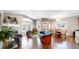 Inviting living room with fireplace, hardwood floors, and large windows for natural light at 6945 N Fargo Trl, Littleton, CO 80125