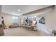 Spacious living room with comfortable seating and view of the staircase at 6945 N Fargo Trl, Littleton, CO 80125