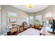 Bright office space with hardwood floors, multiple windows, and built-in shelving at 6945 N Fargo Trl, Littleton, CO 80125