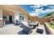 The home boasts an outdoor patio with a stone fire pit, outdoor seating, and a built-in grill at 6945 N Fargo Trl, Littleton, CO 80125