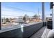 Exterior balcony view with solar panels on the adjacent building showing an environmentally conscious neighborhood at 1245 Utica St # 105, Denver, CO 80204
