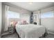 This bedroom features a bed, a window, curtains and a bedside table and lamp at 1245 Utica St # 105, Denver, CO 80204