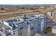 Modern apartment building with rooftop terraces and mountain views, located near train line at 1245 Utica St # 105, Denver, CO 80204