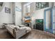 Bright living area with large windows, a comfortable sofa, entertainment center, and stylish decor at 1245 Utica St # 105, Denver, CO 80204