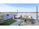 This rooftop features a sitting area, a fire pit table and beautiful mountain views at 1245 Utica St # 105, Denver, CO 80204