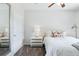 Cozy bedroom with a nightstand and bedside lamp at 7440 S Blackhawk St # 14-103, Englewood, CO 80112
