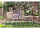 Attractive community sign with brick facade, unique metal art, manicured flower beds and windmill detail at 7440 S Blackhawk St # 14-103, Englewood, CO 80112