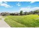 A large grassy area in the community with walking path and benches at 7440 S Blackhawk St # 14-103, Englewood, CO 80112