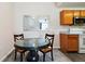 Cozy dining area next to kitchen featuring a dark table and two chairs at 7440 S Blackhawk St # 14-103, Englewood, CO 80112
