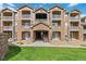 Beautiful condo exterior featuring stone accents, balconies, and well-maintained landscaping at 7440 S Blackhawk St # 14-103, Englewood, CO 80112