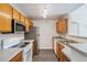 Bright kitchen featuring stainless steel appliances and tile flooring at 7440 S Blackhawk St # 14-103, Englewood, CO 80112