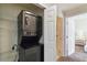 View of in-unit laundry and open doorways at 7440 S Blackhawk St # 14-103, Englewood, CO 80112