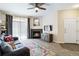 Comfortable living room with fireplace, large window, and stylish decor at 7440 S Blackhawk St # 14-103, Englewood, CO 80112