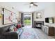 Bright living space with comfortable seating, fireplace, and natural light from a window at 7440 S Blackhawk St # 14-103, Englewood, CO 80112