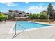 A community pool with outdoor lounge chairs at 7440 S Blackhawk St # 14-103, Englewood, CO 80112