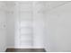 A walk-in closet features white walls and wire shelving at 7440 S Blackhawk St # 14-103, Englewood, CO 80112