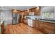 Kitchen with stainless steel appliances, granite countertops, and wood cabinets at 6243 S Elati St, Littleton, CO 80120
