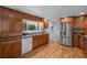 Spacious kitchen with stainless steel appliances, granite countertops, and ample cabinet space at 6243 S Elati St, Littleton, CO 80120