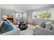 Inviting living room with a cozy fireplace, hardwood floors, and bright natural light at 6243 S Elati St, Littleton, CO 80120