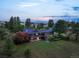 Expansive home on a sprawling lot with mature trees and lush landscaping at 8092 Ponderosa Ln, Parker, CO 80138