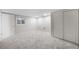 Finished basement with neutral carpet, recessed lighting and adjacent closet and room at 8092 Ponderosa Ln, Parker, CO 80138