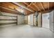 Unfinished basement with open ceilings and exposed wood beams, perfect for storage or conversion at 8092 Ponderosa Ln, Parker, CO 80138