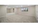 Large finished basement with multiple windows providing ample natural light at 8092 Ponderosa Ln, Parker, CO 80138