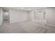 Finished basement with neutral carpet, recessed lights, and entryways to other rooms at 8092 Ponderosa Ln, Parker, CO 80138