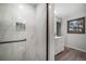 Renovated bathroom features an elegant shower and a sleek vanity with ample natural light at 8092 Ponderosa Ln, Parker, CO 80138